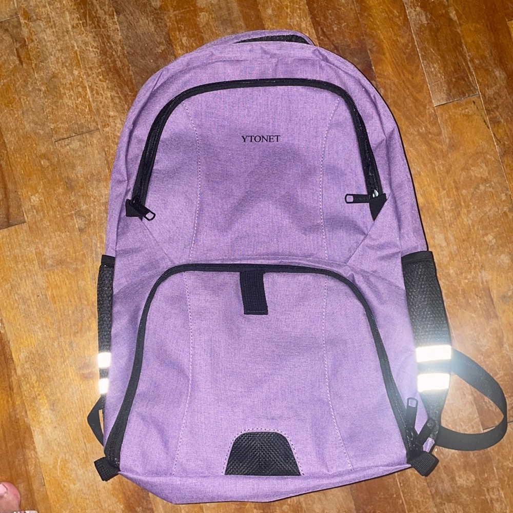 Ytonet Never used purple travel backpack. 21 inches. Very lightweight.